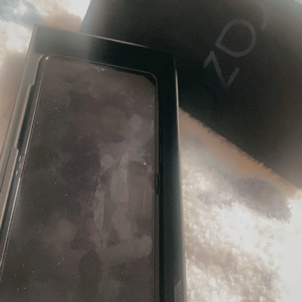 Motorola Black Smartphone with Black Box